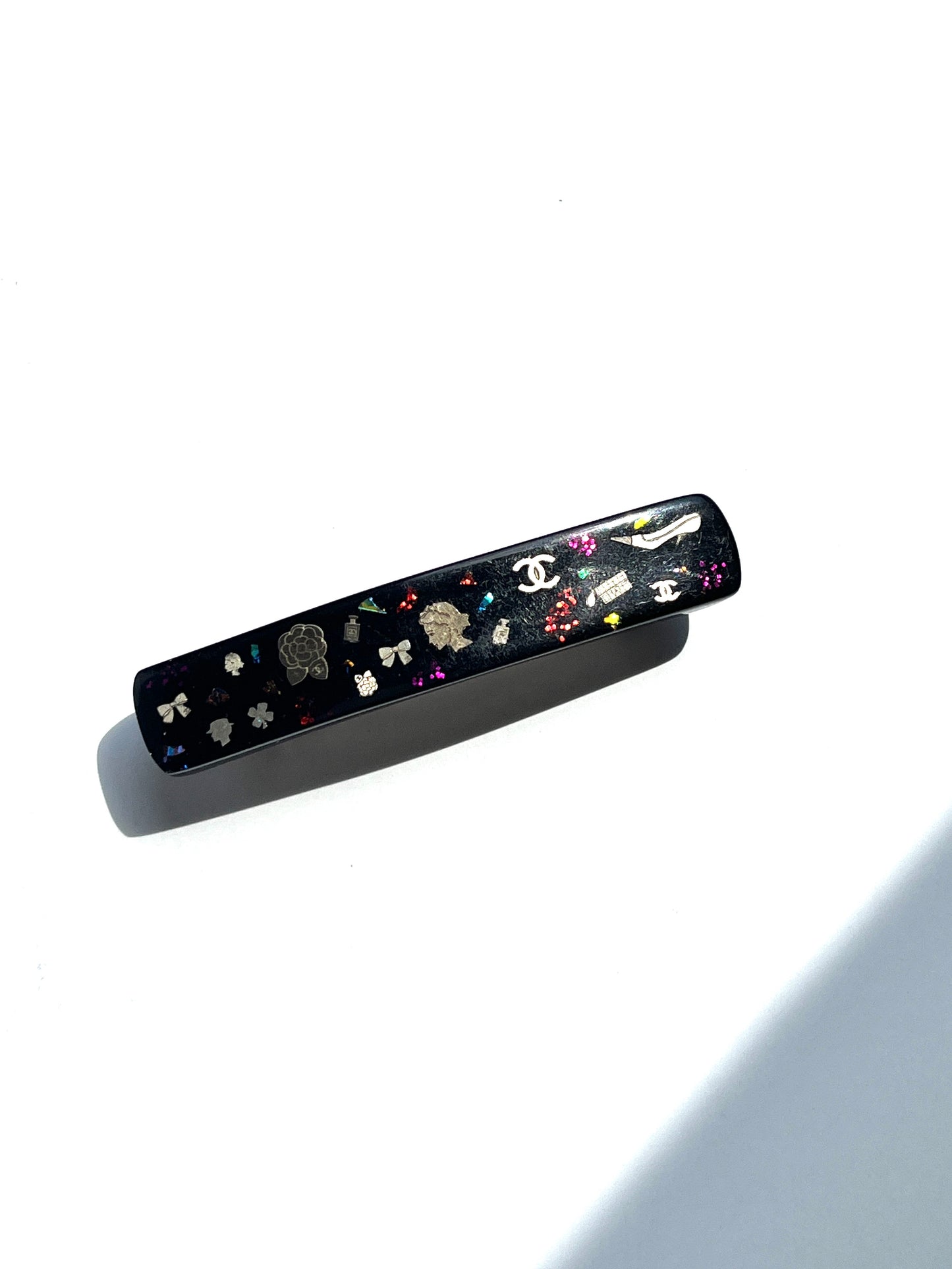 CHANEL Black Multi Logo Glitter Embellished Print Hair Clip