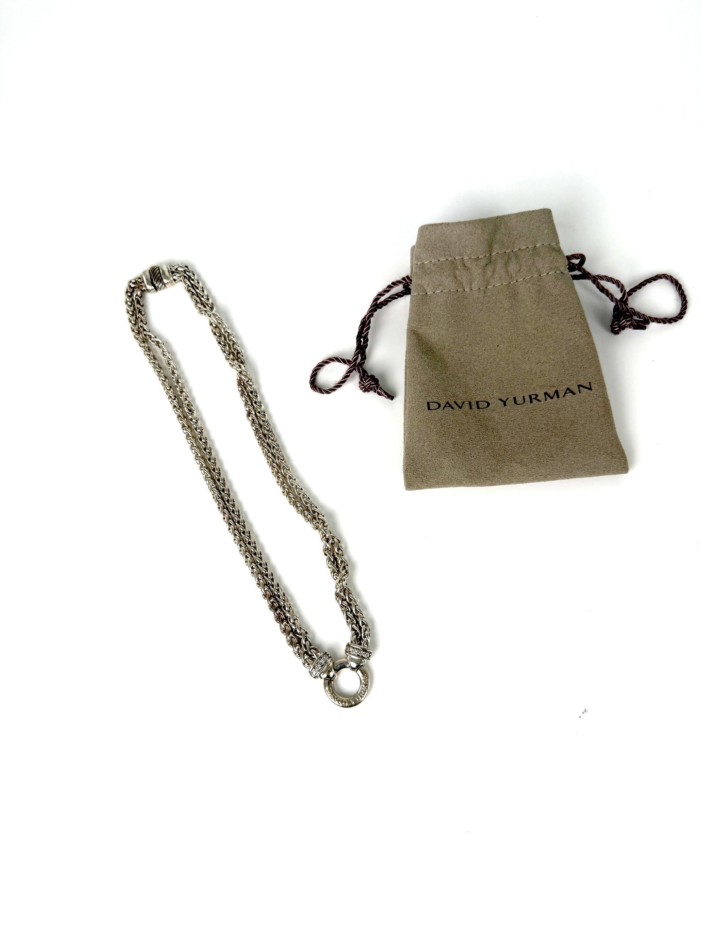 Designer: David Yurman
Length: 17”
Metal type: 925 sterling silver
Hallmark:  925, Designer signature
Item weight: 58g
Gemstone: 12 Diamonds, near colorless
Condition: Excellent. Light hairline scratches and discoloration at metal. Please see the photographs.
Inclusions: Pouch.
Retail price: $1350

Attach a DY Albion pendant to this necklace or wear it alone.  A classic piece of jewelry from David Yurman that will last for generations to come.

All items sold by Fashion Reloved are guaranteed authentic and 