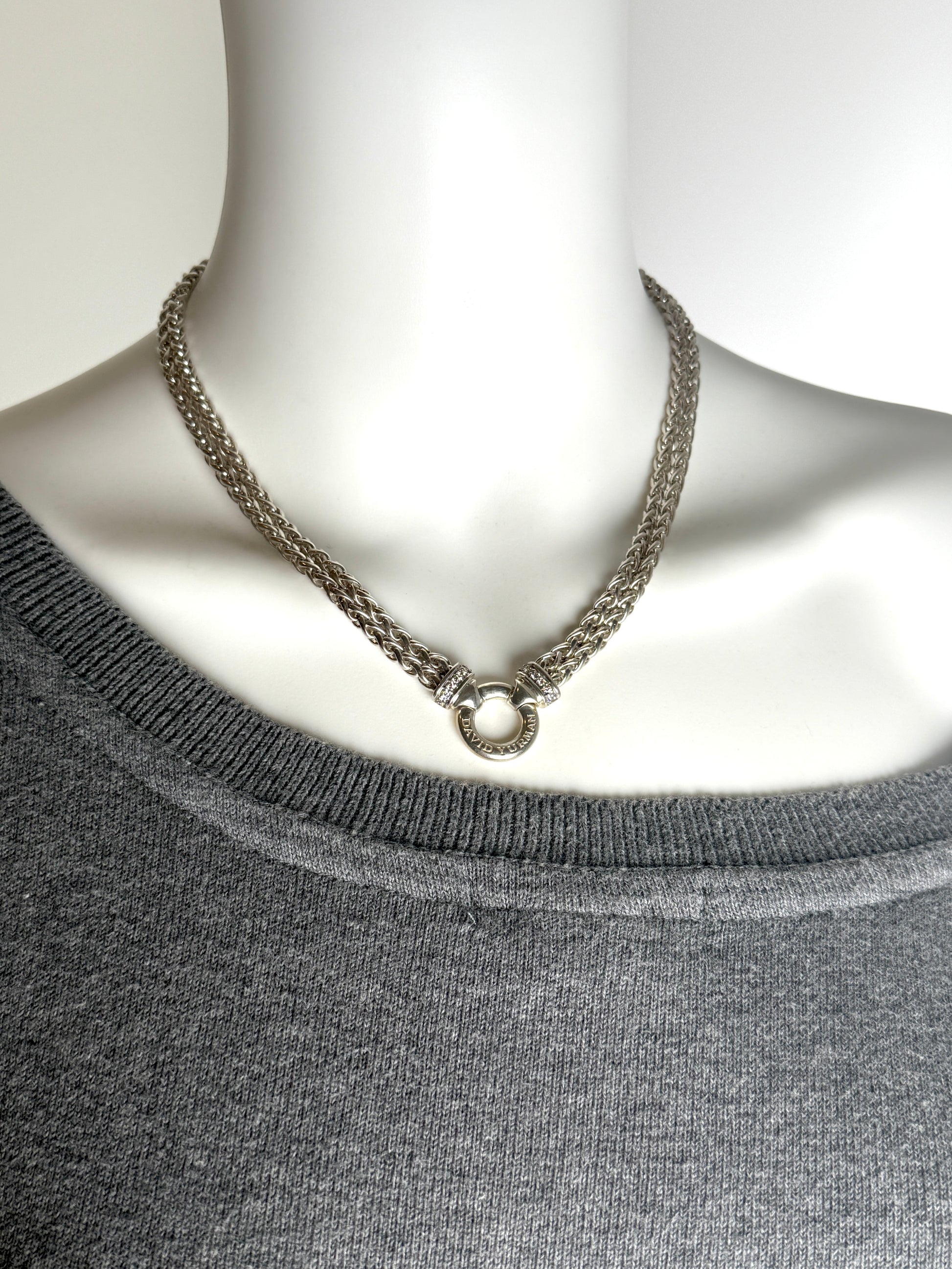 Designer: David Yurman
Length: 17”
Metal type: 925 sterling silver
Hallmark:  925, Designer signature
Item weight: 58g
Gemstone: 12 Diamonds, near colorless
Condition: Excellent. Light hairline scratches and discoloration at metal. Please see the photographs.
Inclusions: Pouch.
Retail price: $1350

Attach a DY Albion pendant to this necklace or wear it alone.  A classic piece of jewelry from David Yurman that will last for generations to come.

All items sold by Fashion Reloved are guaranteed authentic and 
