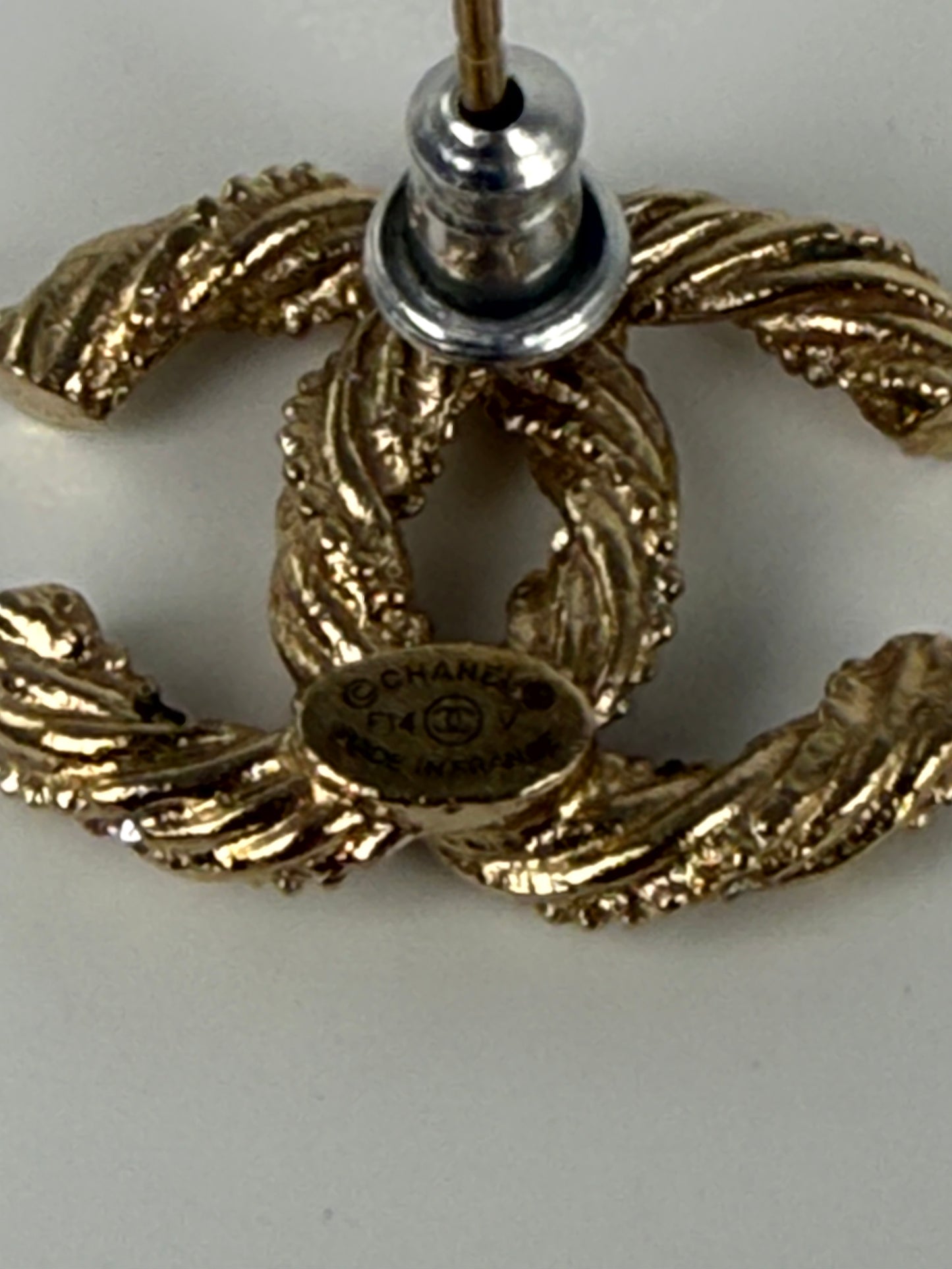 CHANEL CC Stud Light Gold Twisted Rhinestone Earrings