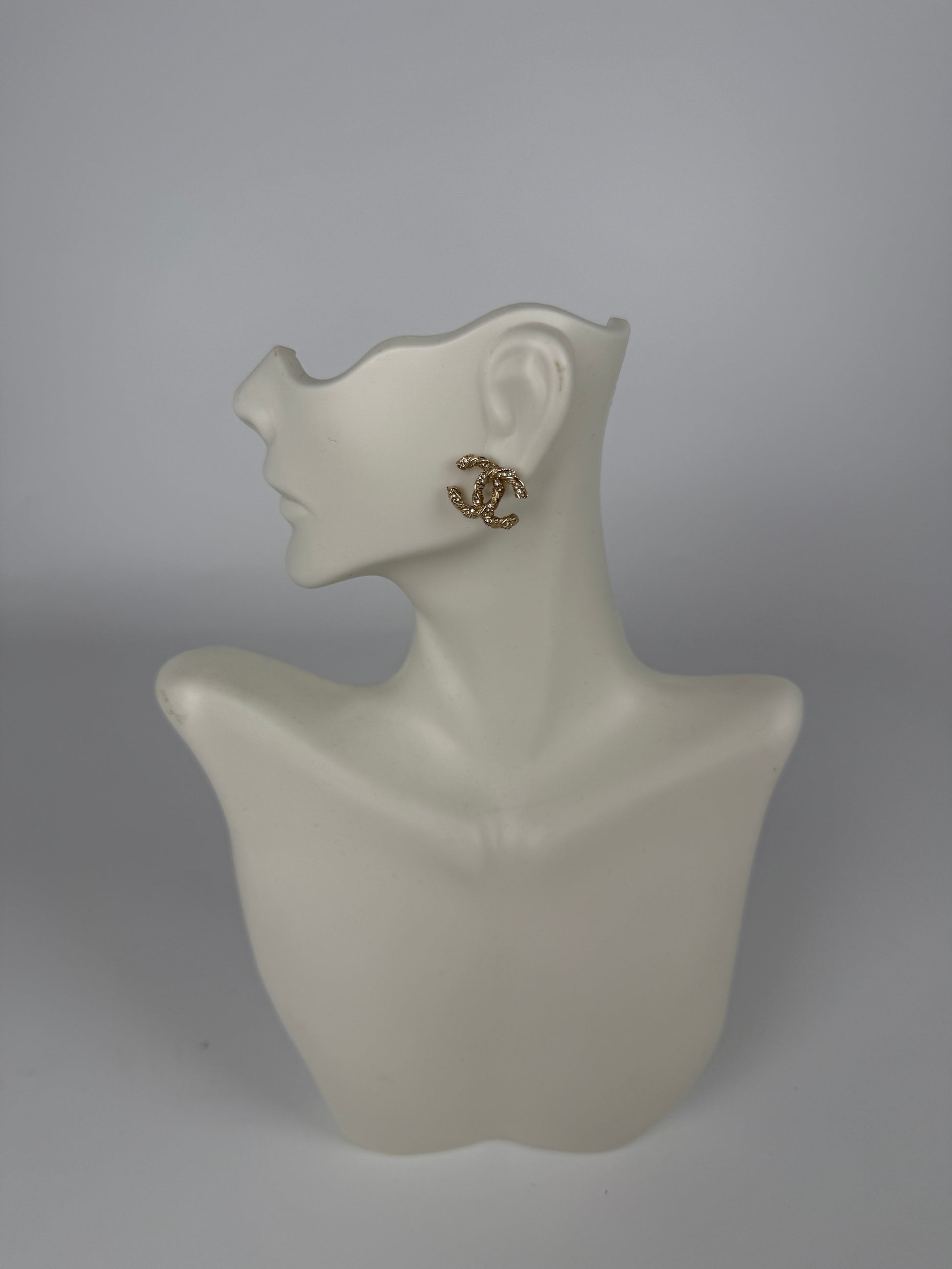 CHANEL CC Stud Light Gold Twisted Rhinestone Earrings